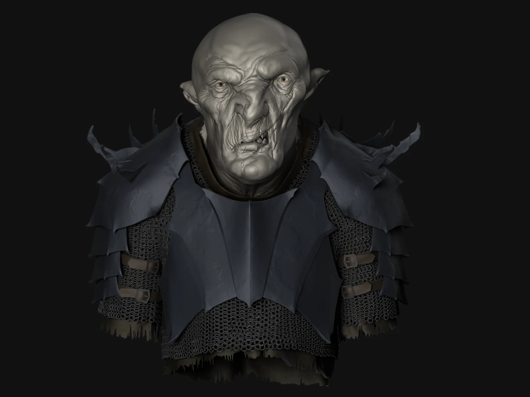Front view of the orc bust facing the viewer, wearing dark layered shoulder armor over chainmail.