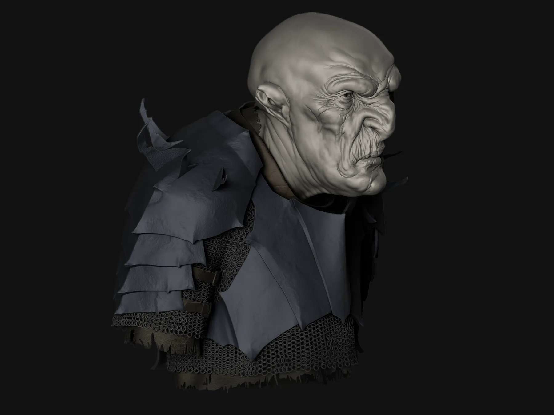 Three-quarter view of the orc bust turned to the side, showing the heavy brow and layered shoulder plates.